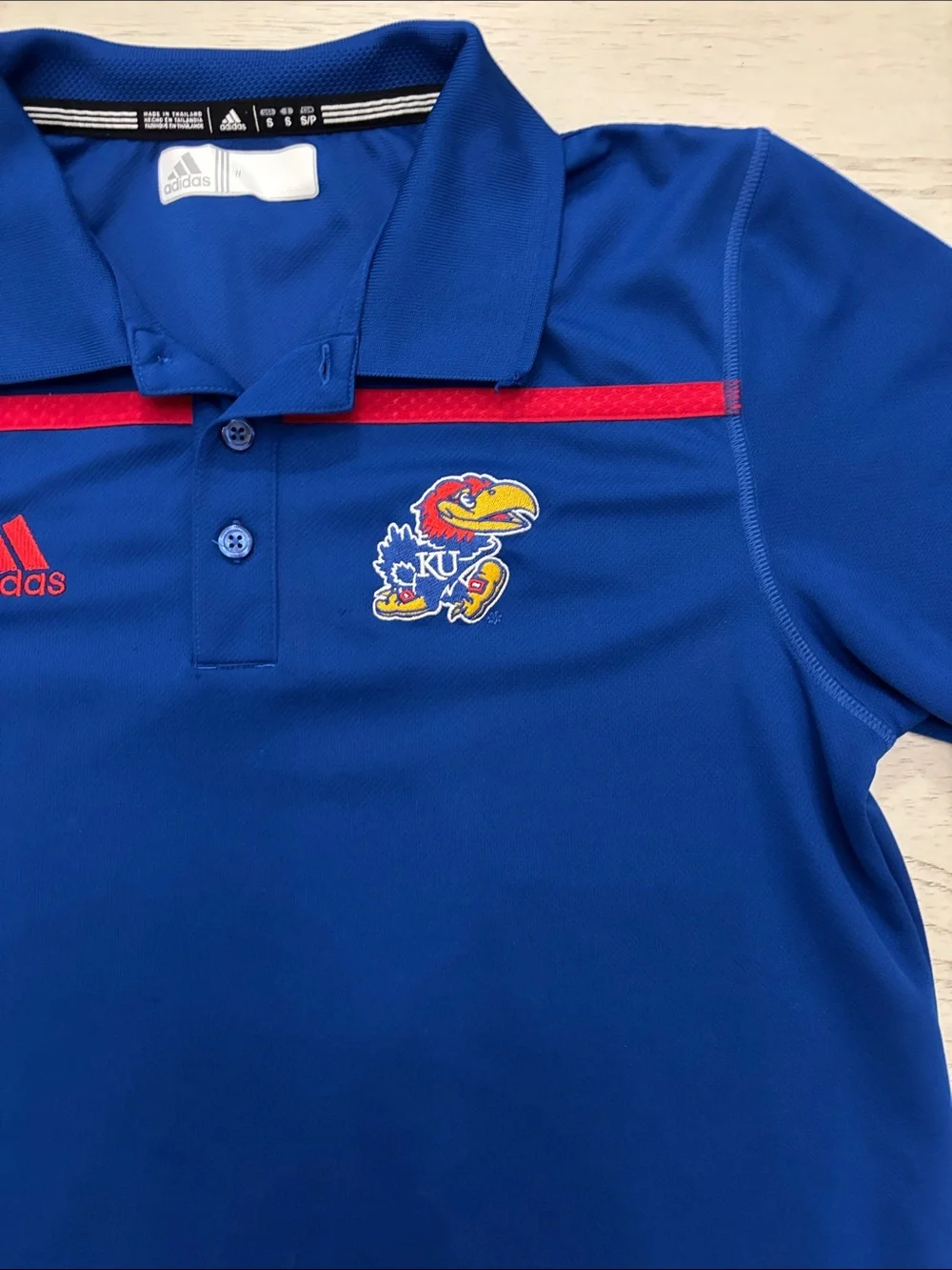 Adidas Kansas Jayhawks (KU) performance polo shirt in men’s size Small.